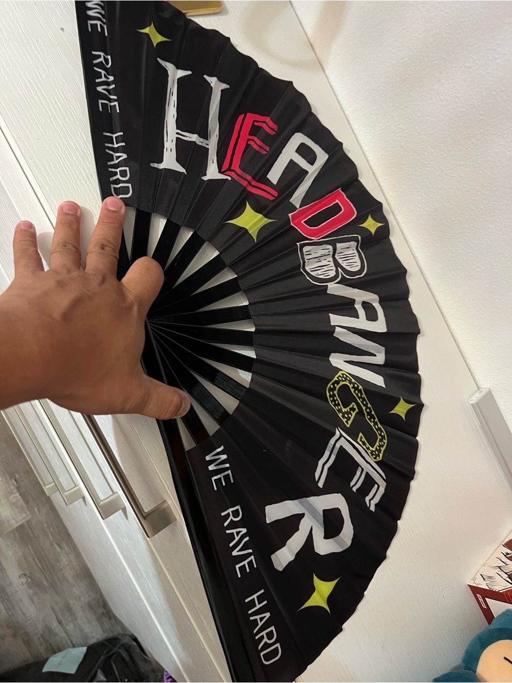 Black Hand Fan with 'HEADBANGER' Text